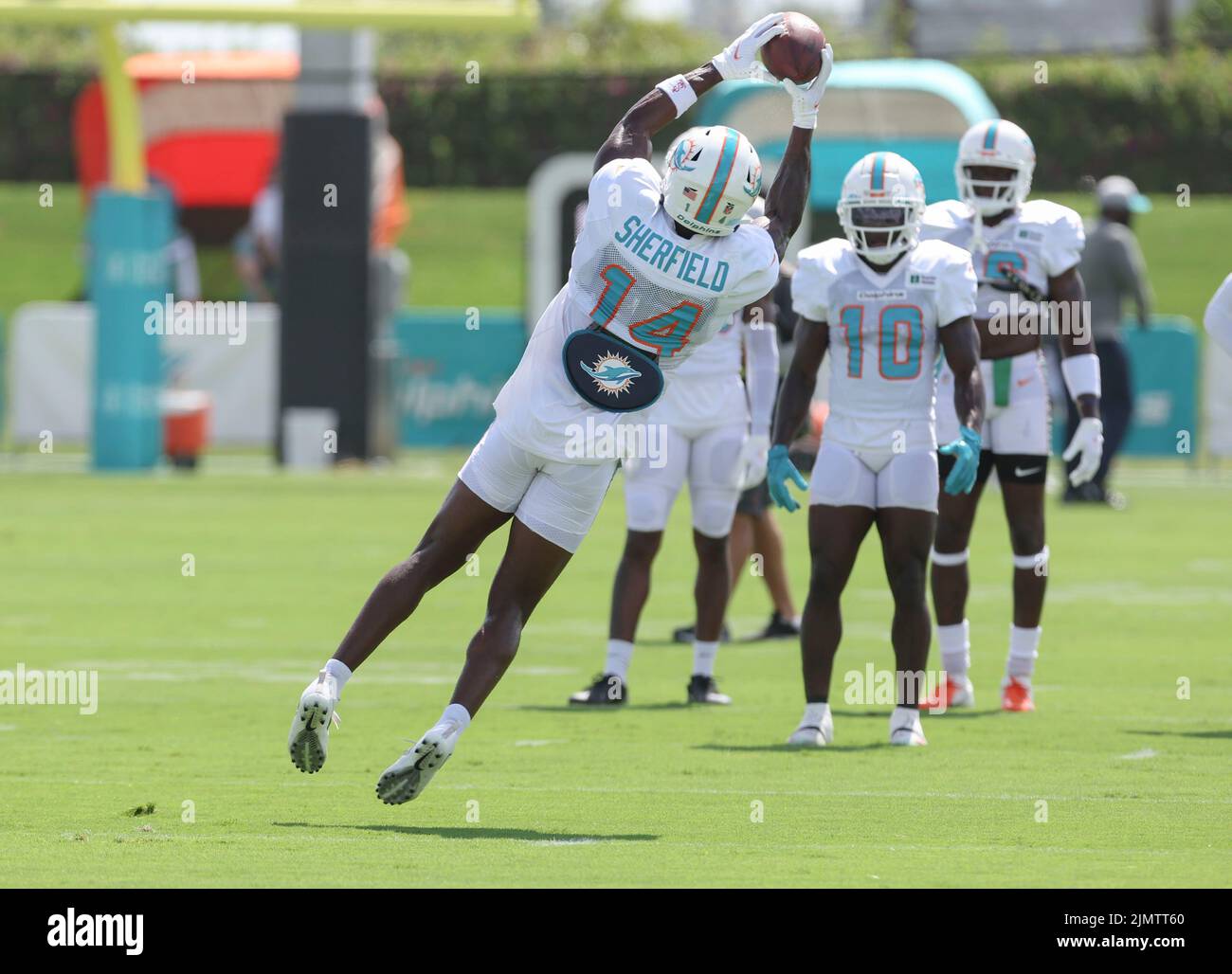 Miami. FL USA; Wide receiver Trent Sherfield (14) makes a reception during Miami Dolphins Training Camp, Saturday, August 6, 2022, at Baptist Health T Stock Photo
