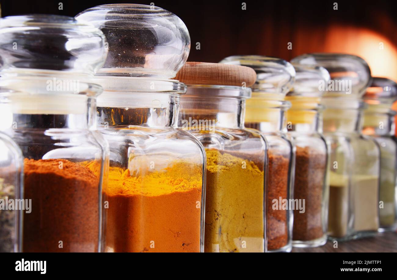 Glass storage jars with spices and herbs Stock Photo - Alamy