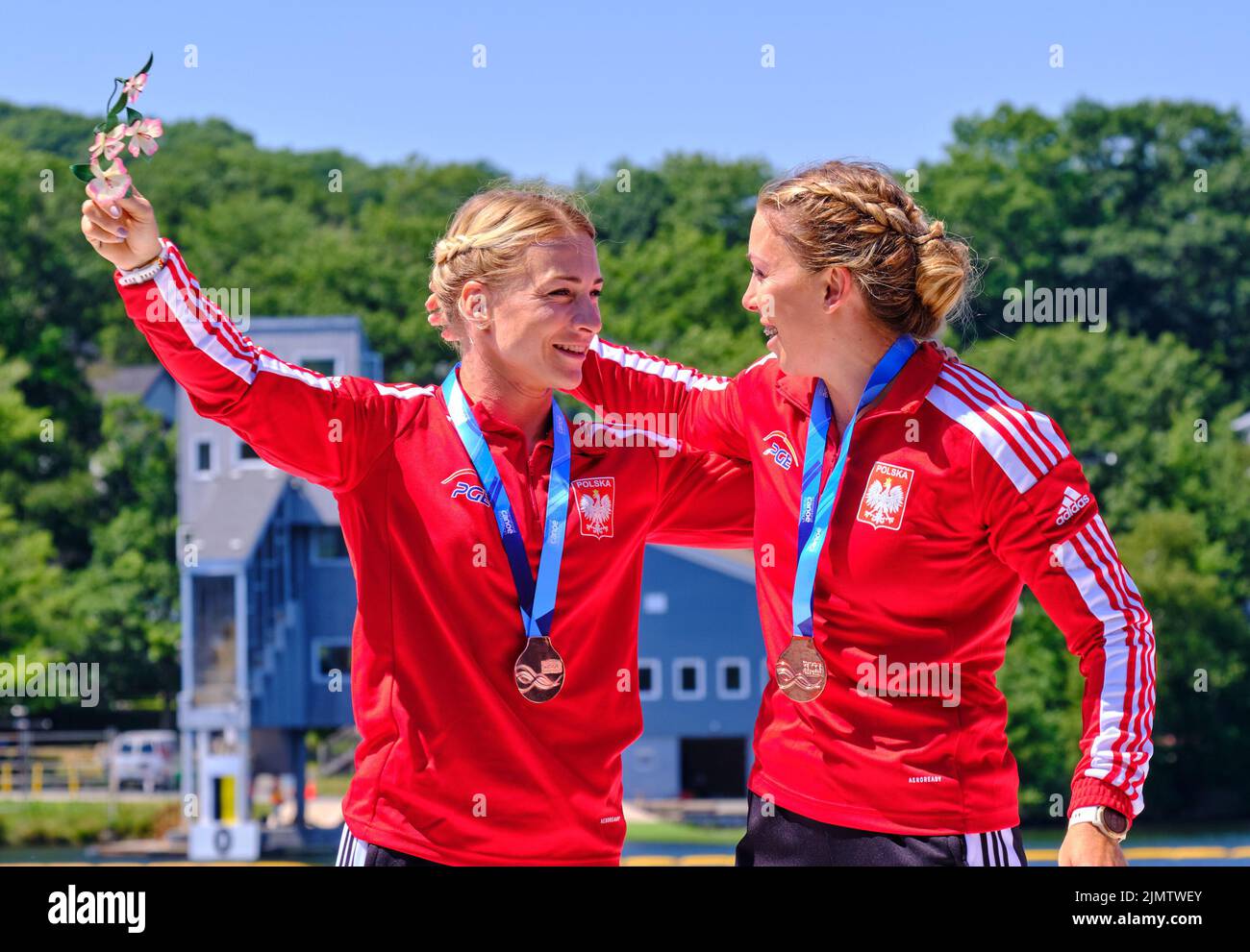 Dartmouth, Canada. August 7th, 2022. Gold Medalists and World Champion Karolina Naja and Anna Pulawska from Poland receive their medal in the K2 Women 500m event which they won close race over Germany, Belgium taking the Bronze. The 2022 ICF Canoe Sprint and Paracanoe World Championships takes place on Lake Banook in Dartmouth (Halifax). Credit: meanderingemu/Alamy Live News Stock Photo