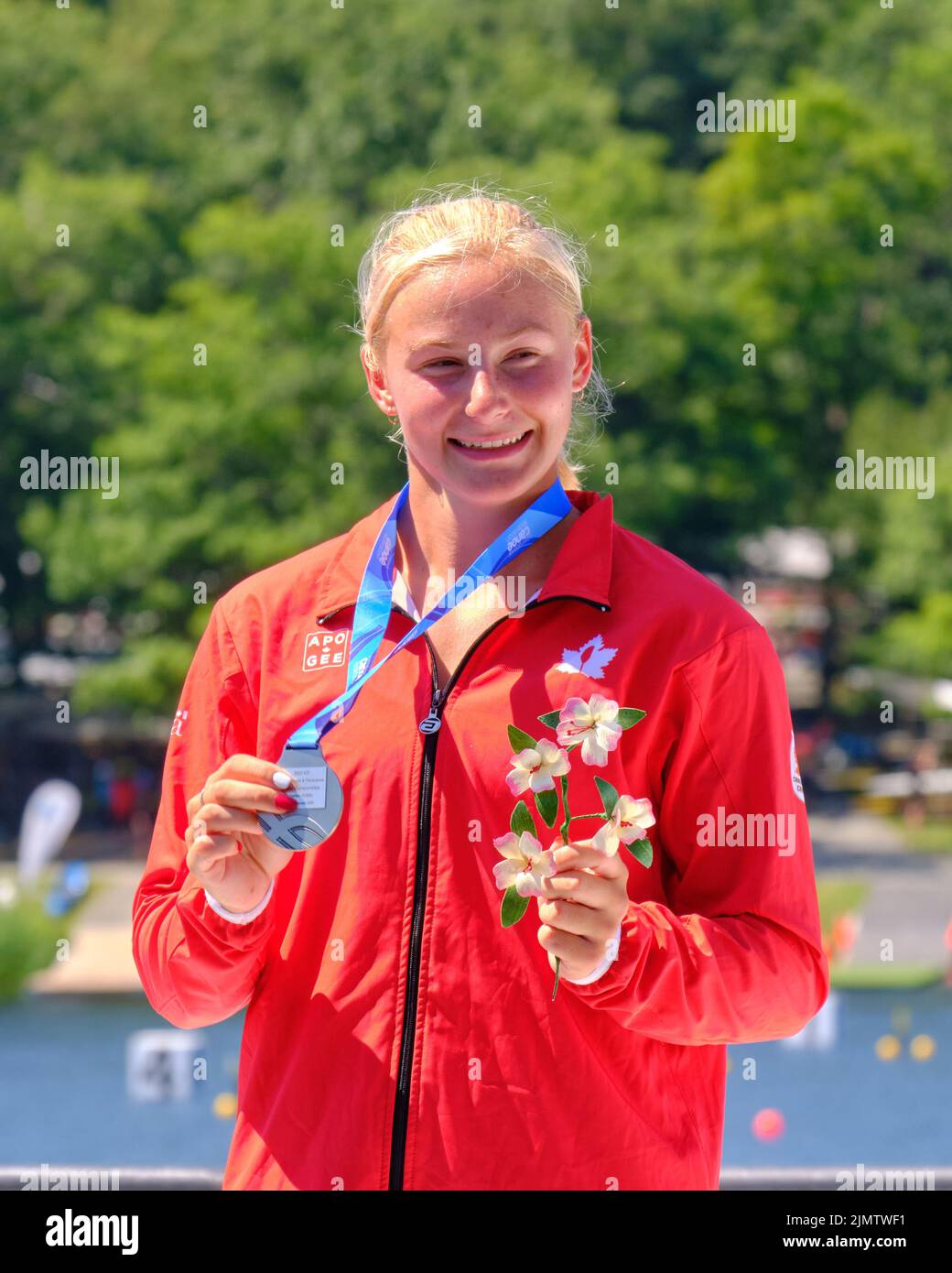 Dartmouth, Canada. August 7th, 2022. Canadian Sophia Jensen receives her silver medal in the C1 Women 500m World Championships race under the cheers of the home crowd. The 2022 ICF Canoe Sprint and Paracanoe World Championships takes place on Lake Banook in Dartmouth (Halifax). Credit: meanderingemu/Alamy Live News Stock Photo