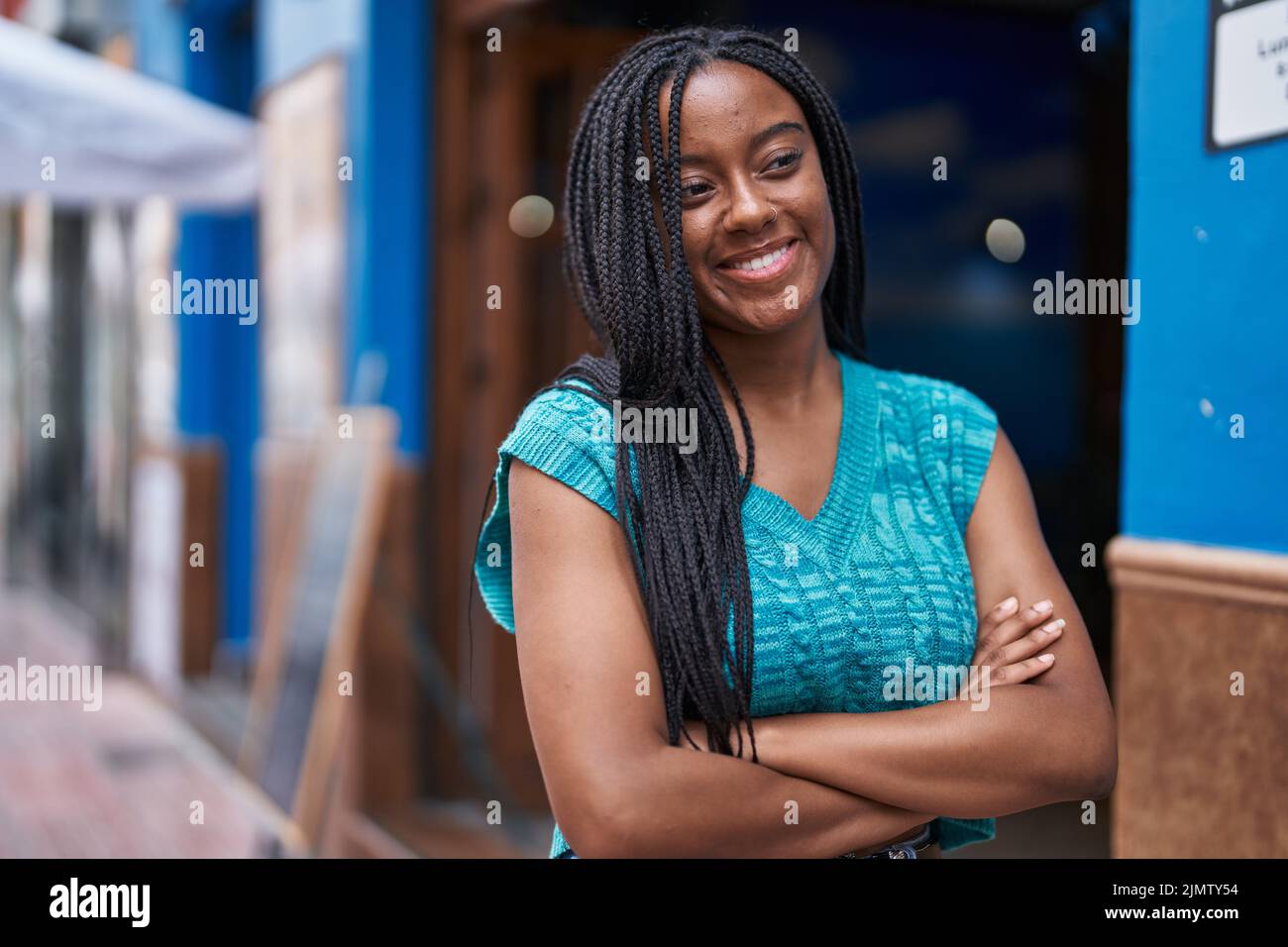 African american woman smiling confident standing with arms crossed ...