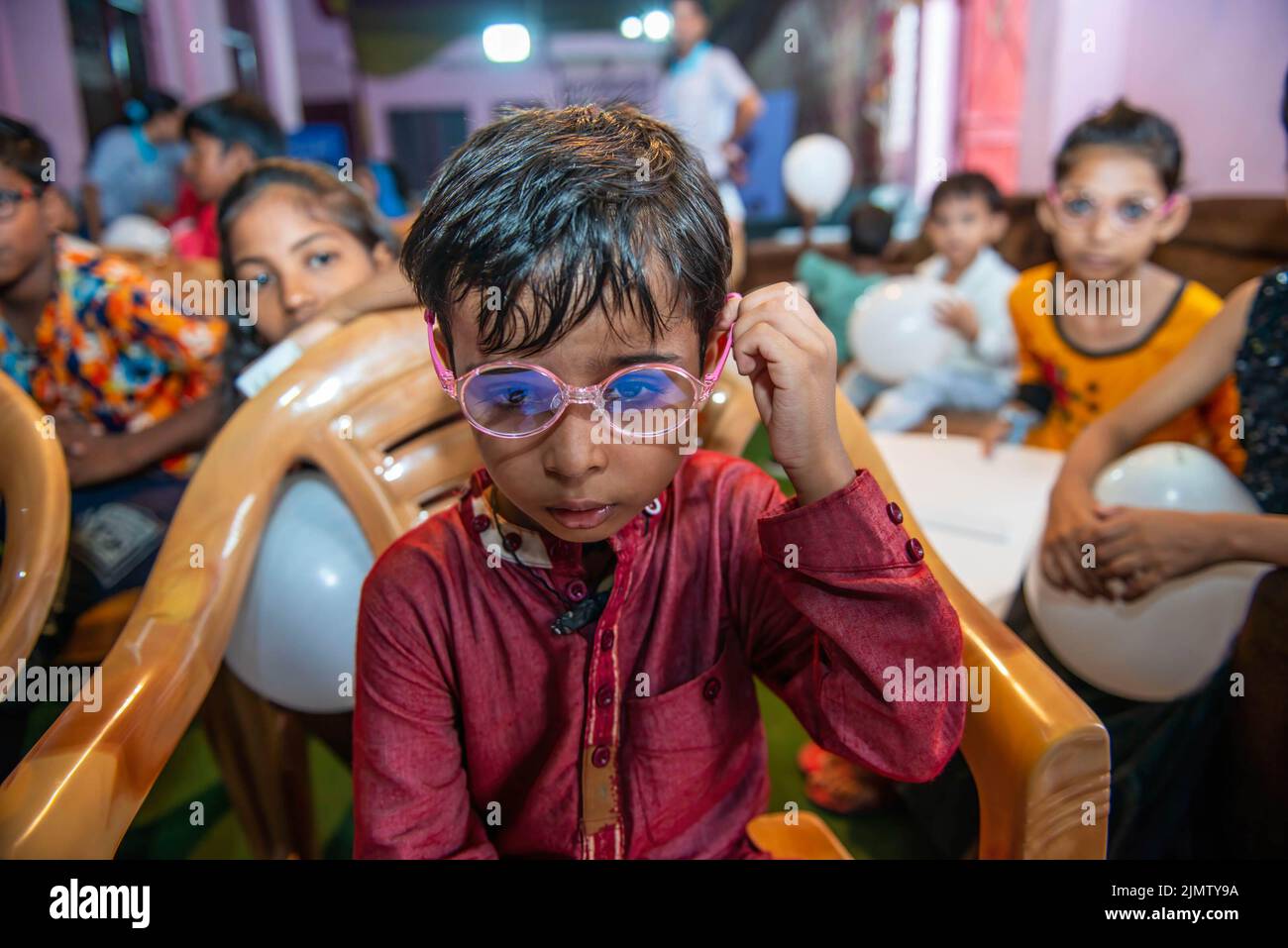 Child wearing eyeglasses seen during the Lenskart Foundation awareness  rally on completing one year as one of the child eye care centre at  Govindpuri. The foundation is a non-profit organisation that provides