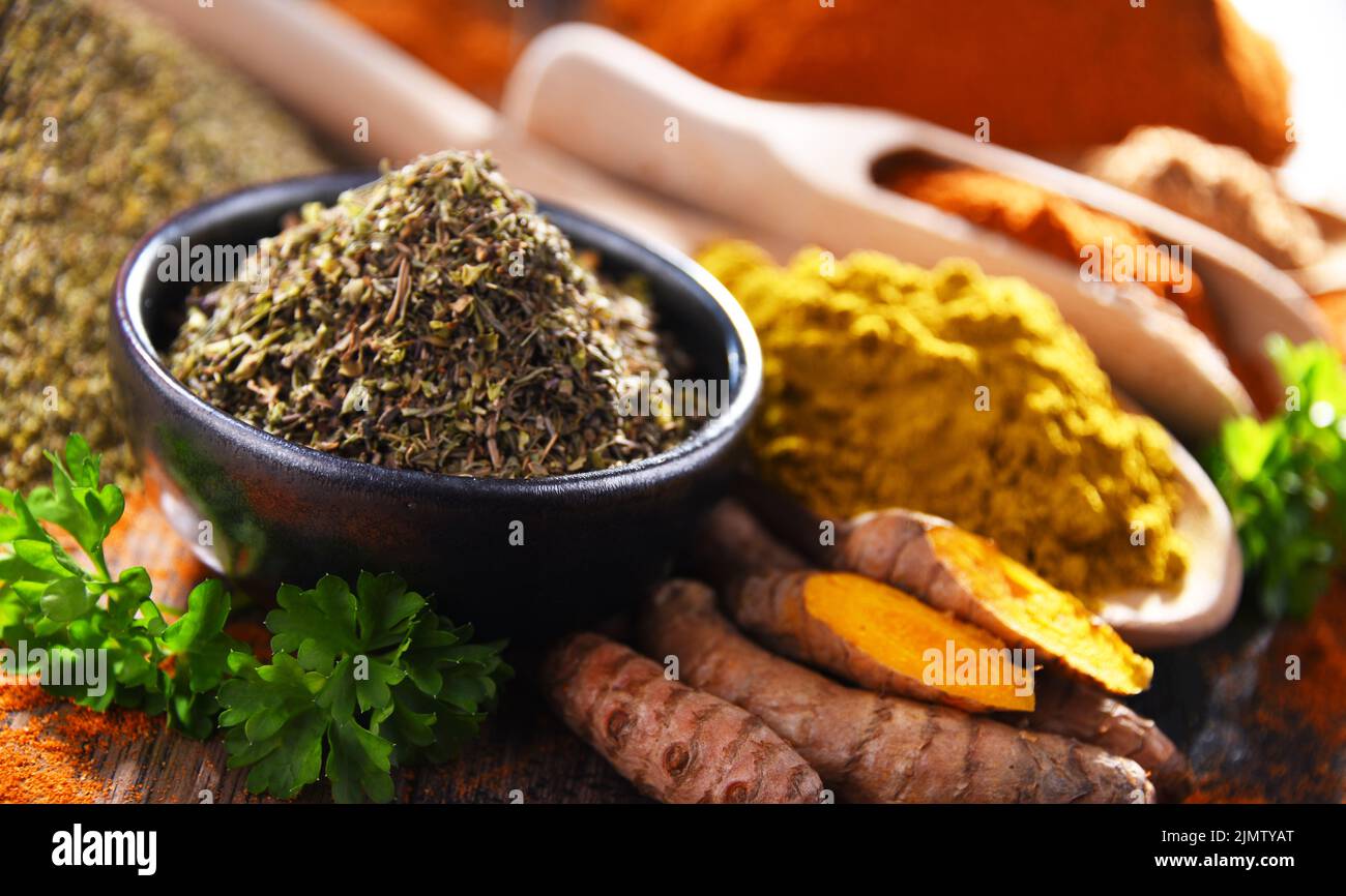 Composition with spices on wooden kitchen table. Stock Photo