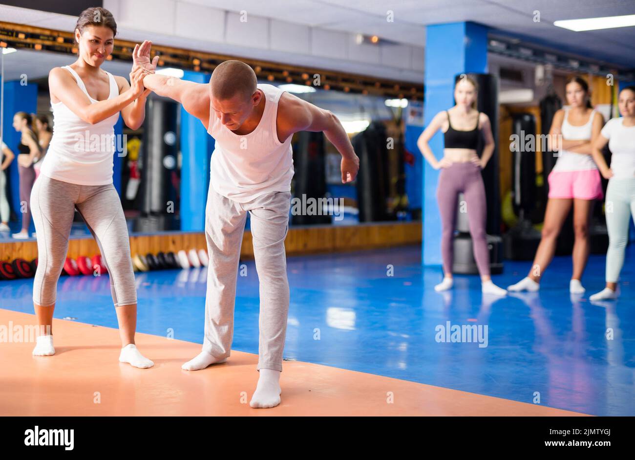 Woman doing wristlock Stock Photo Alamy