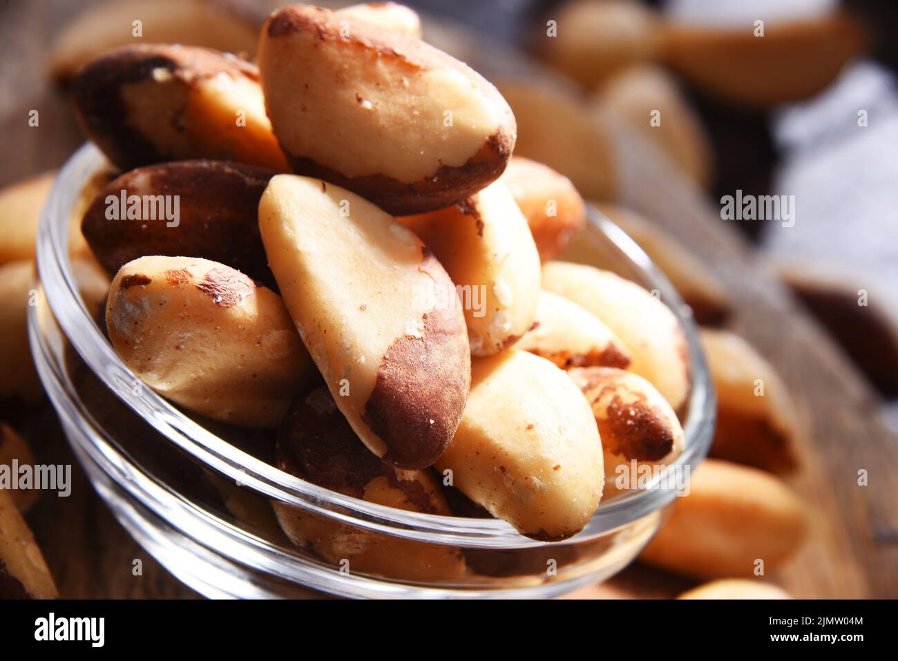 Composition with a bowl of shelled brazil nuts. Delicacies Stock Photo