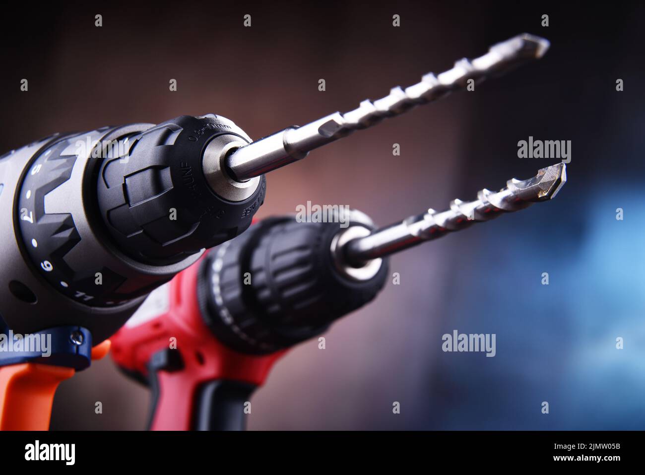 Composition with two cordless drills also working as screw guns Stock Photo