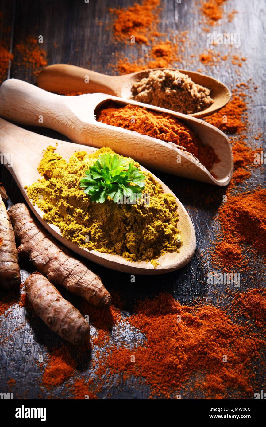 Composition with spices on wooden kitchen table. Stock Photo