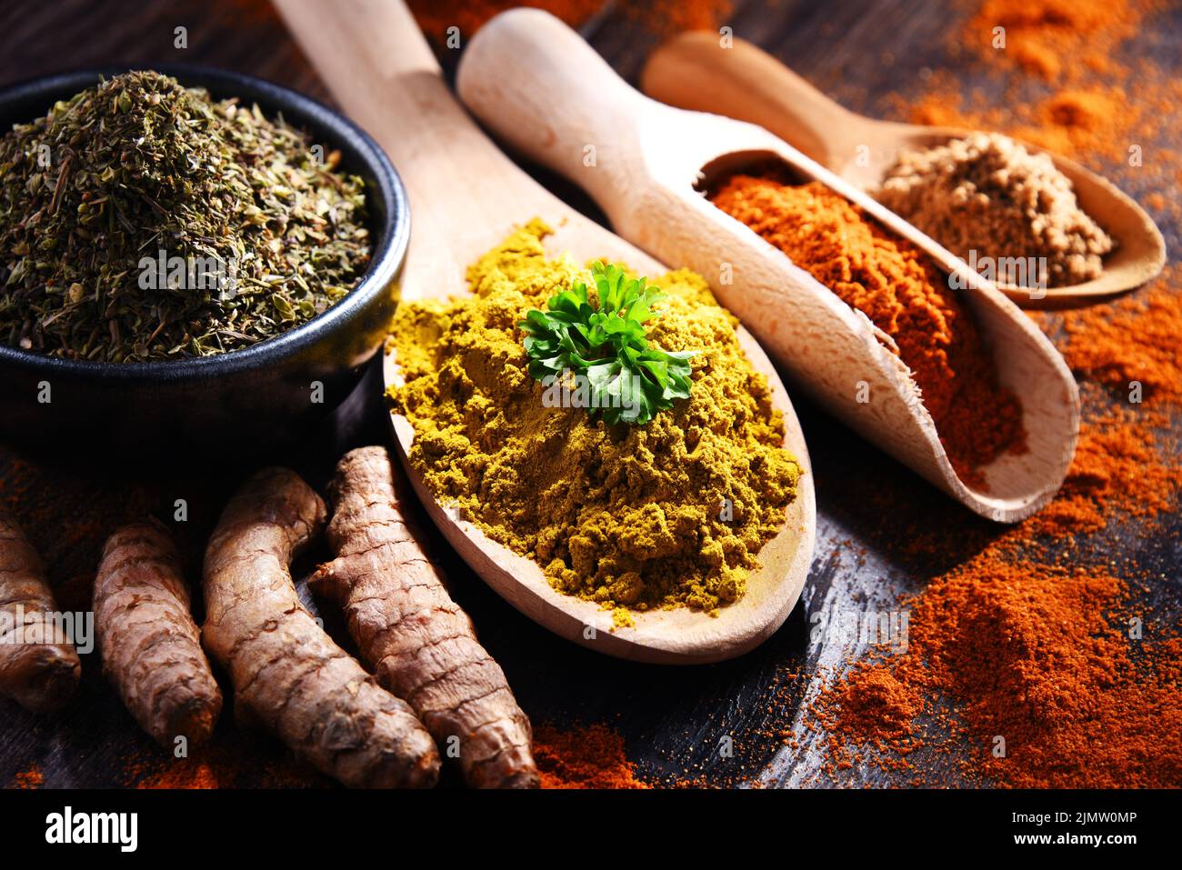 Composition with spices on wooden kitchen table. Stock Photo