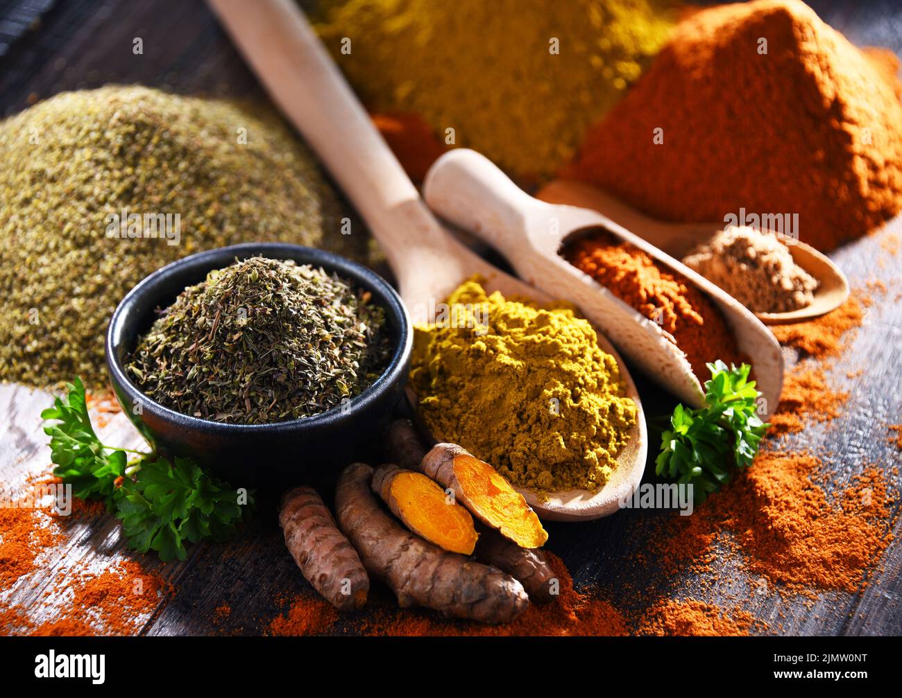Composition with spices on wooden kitchen table. Stock Photo