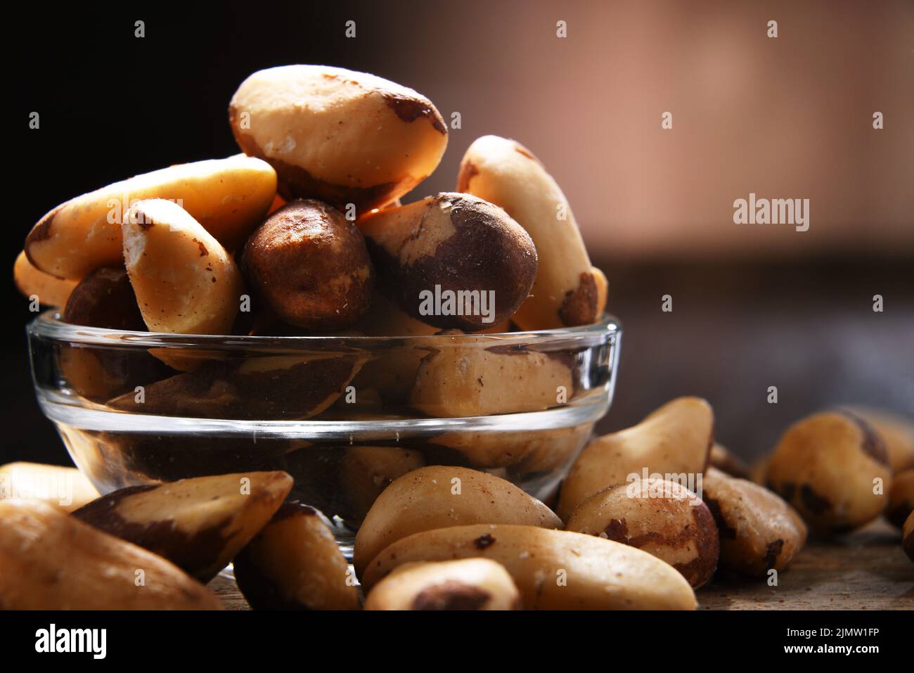 Composition with a bowl of shelled brazil nuts. Delicacies Stock Photo