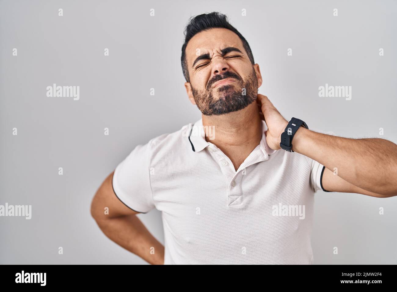 Young hispanic man with beard wearing casual clothes over white