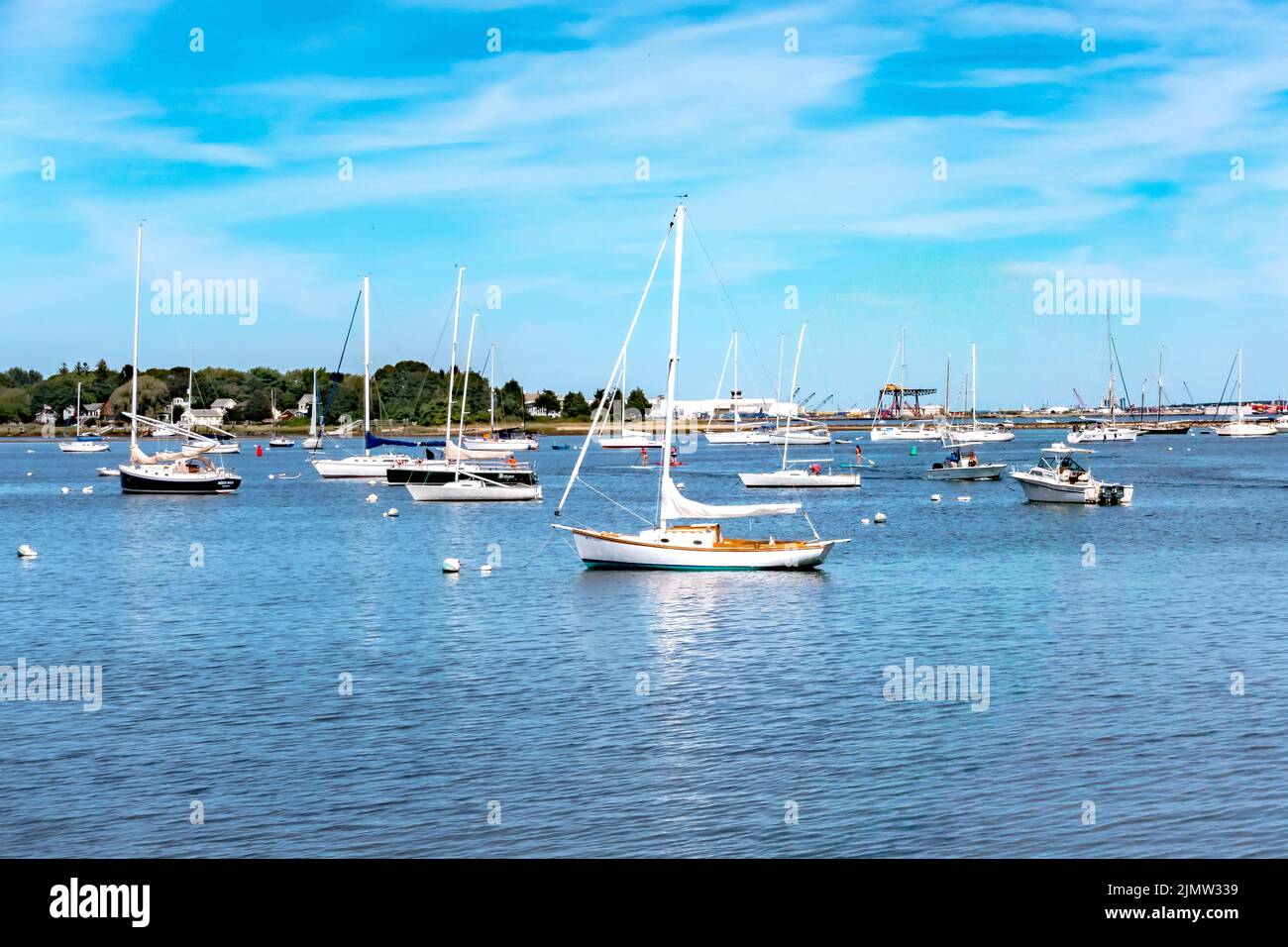 Small boats lining waterfront in Wickford Cove rhode island Stock Photo