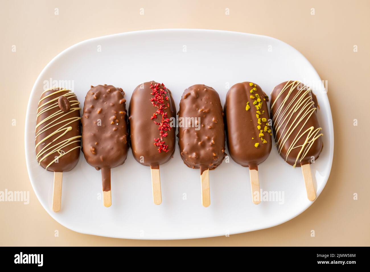 cupcake ice cream with chocolate cream.Chocolate biscuits on a stick in