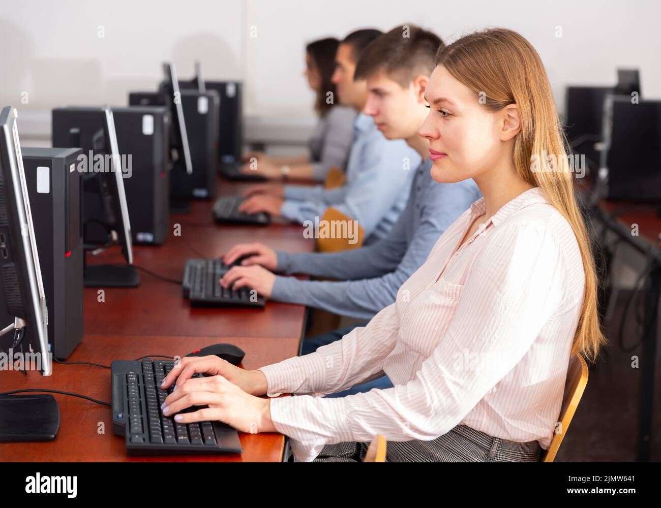 Side view of focused students working Stock Photo