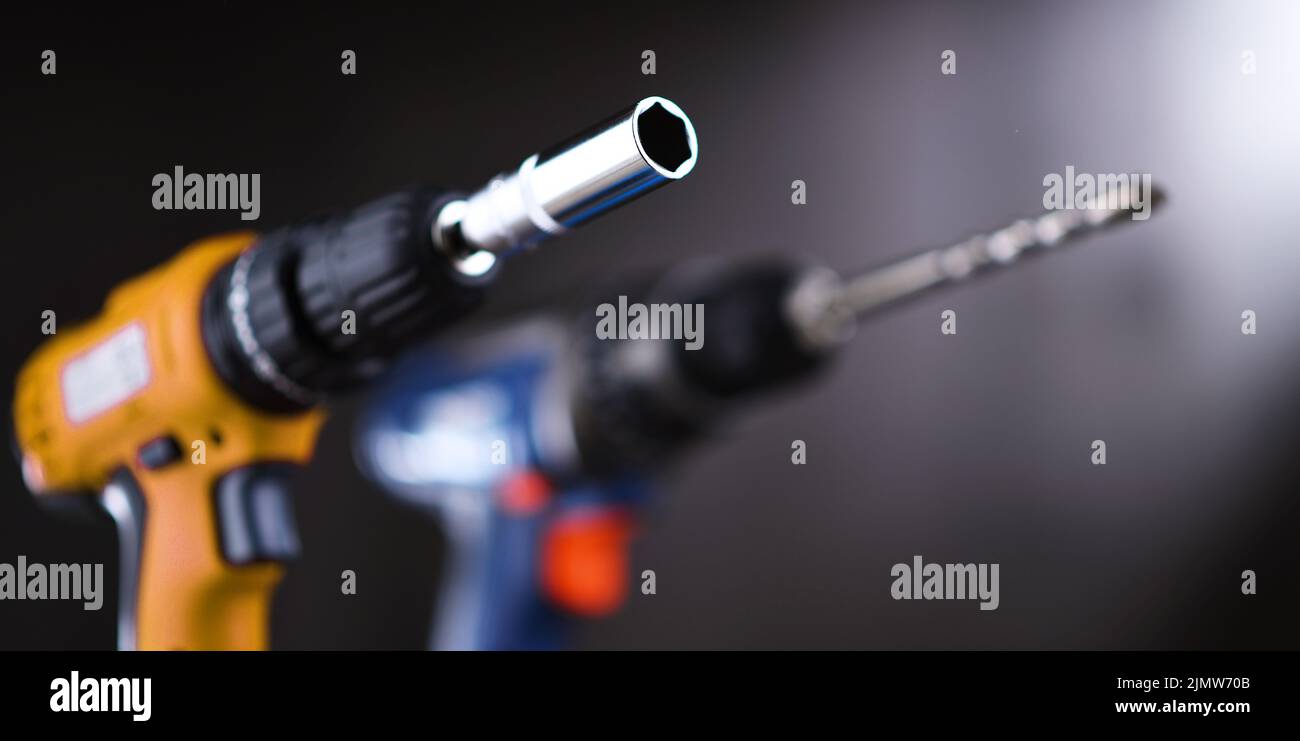A screw gun and a pistolgrip cordless drill Stock Photo Alamy