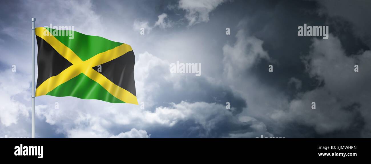 Jamaican flag on a cloudy sky Stock Photo