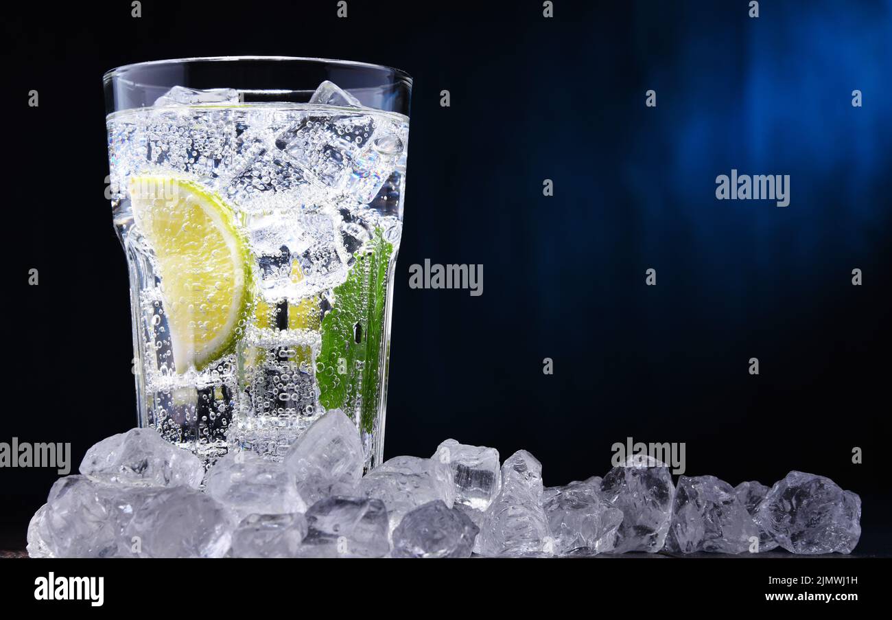 Glass of mineral water with ice Stock Photo - Alamy