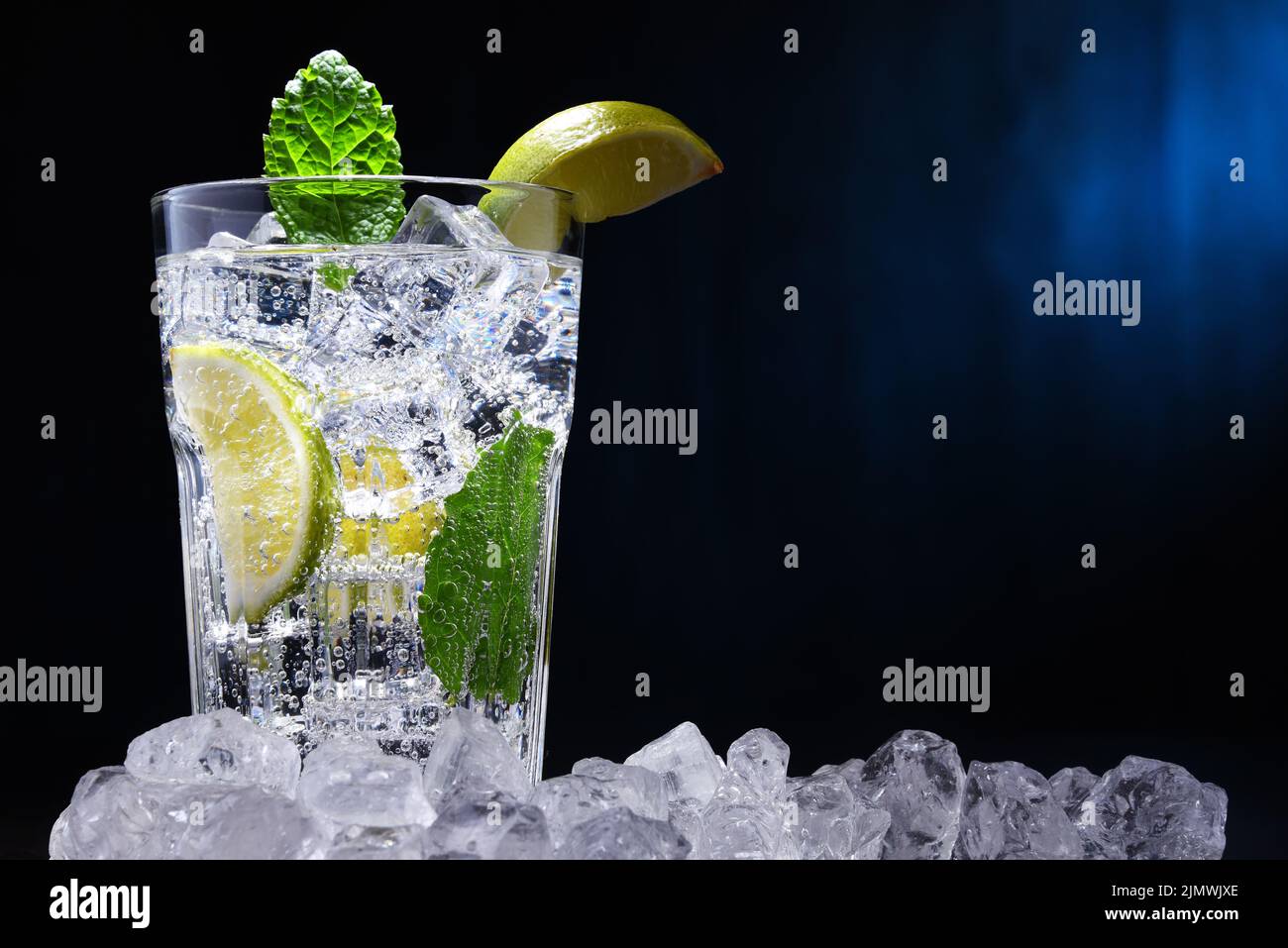 Glass of mineral water with ice Stock Photo - Alamy