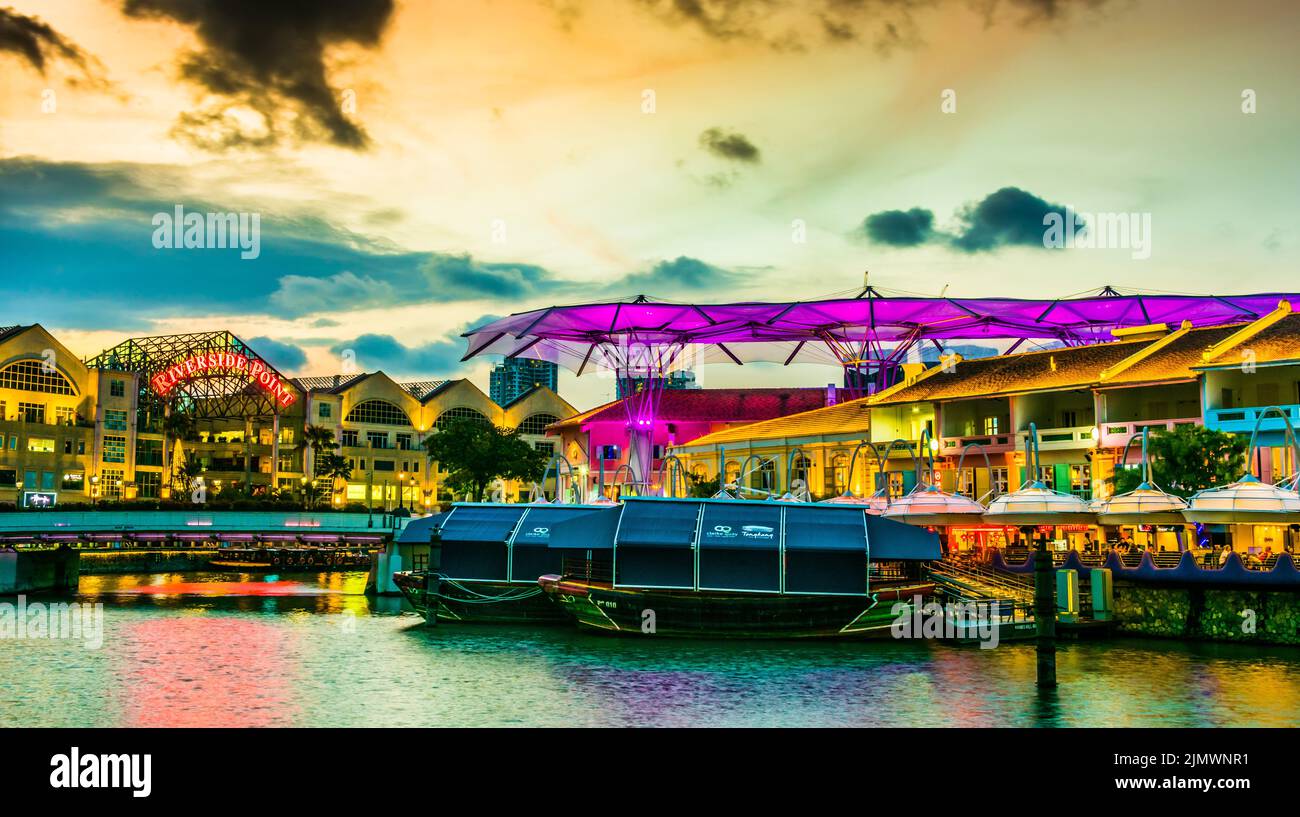 Clarke Quay after dusk, popular nightlife district of Singapore Stock