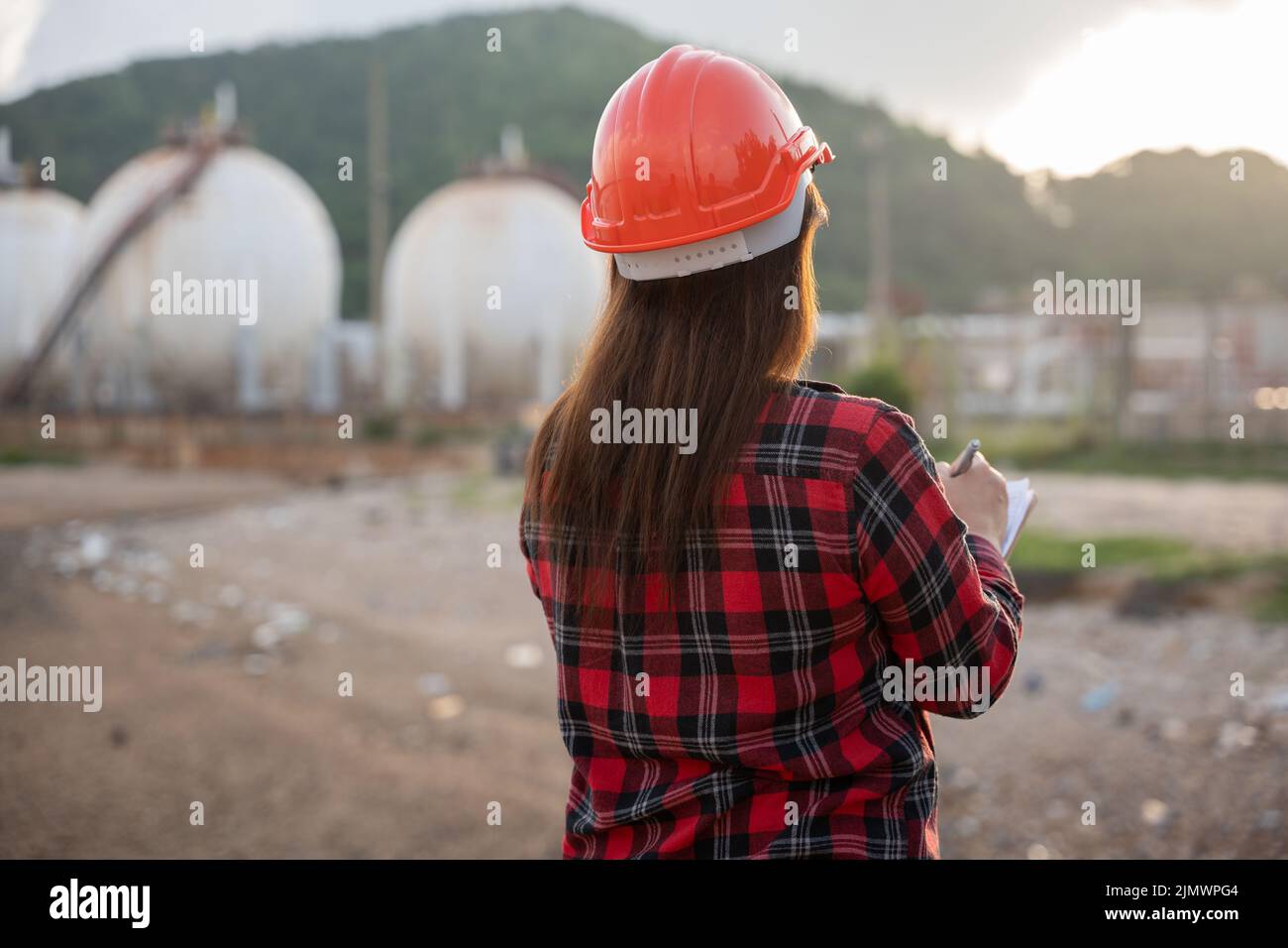 Petroleum Engineers. Happy Asian worker woman in oil chemical industry