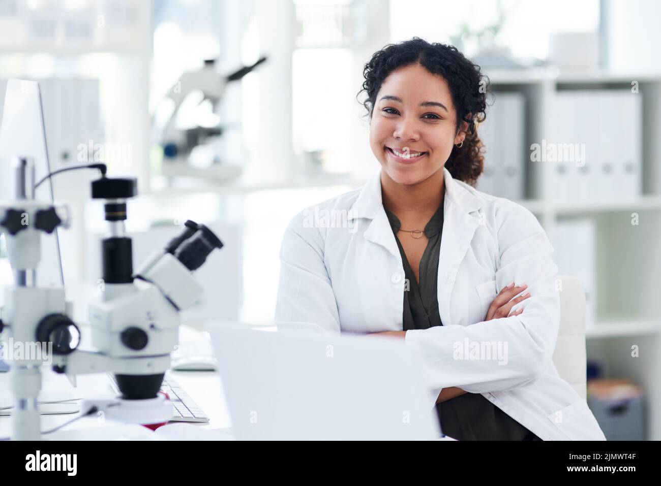 Happy smart scientist sitting hi-res stock photography and images - Alamy