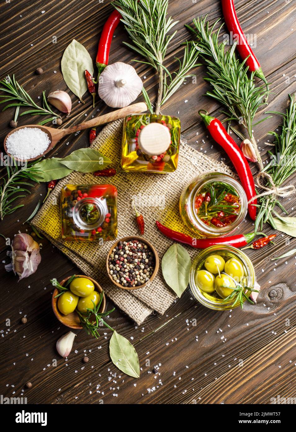 Flat lay food background made of oils condiments and spices on kitchen