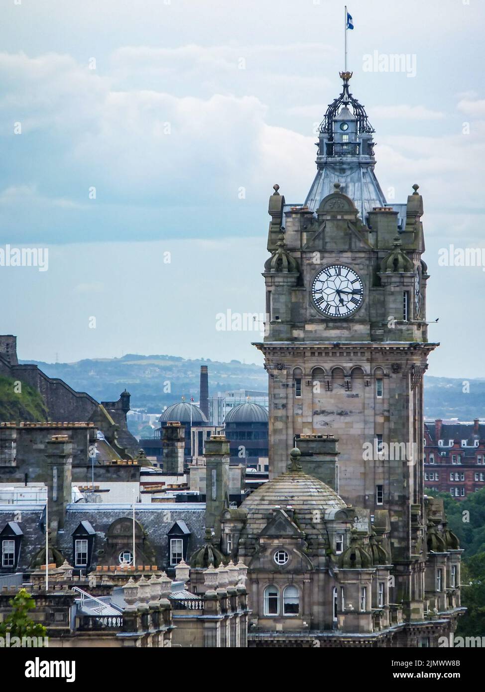 The elegant 1902 Balmoral Hotel clocktower stands above the city of Edinburgh, Lothian, Scotland, UK. Stock Photo