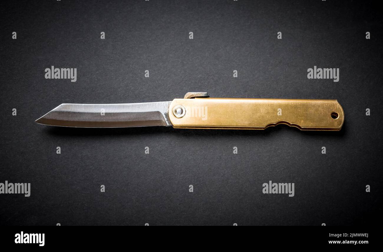 Traditional japanese pocket knife on black background Stock Photo Alamy