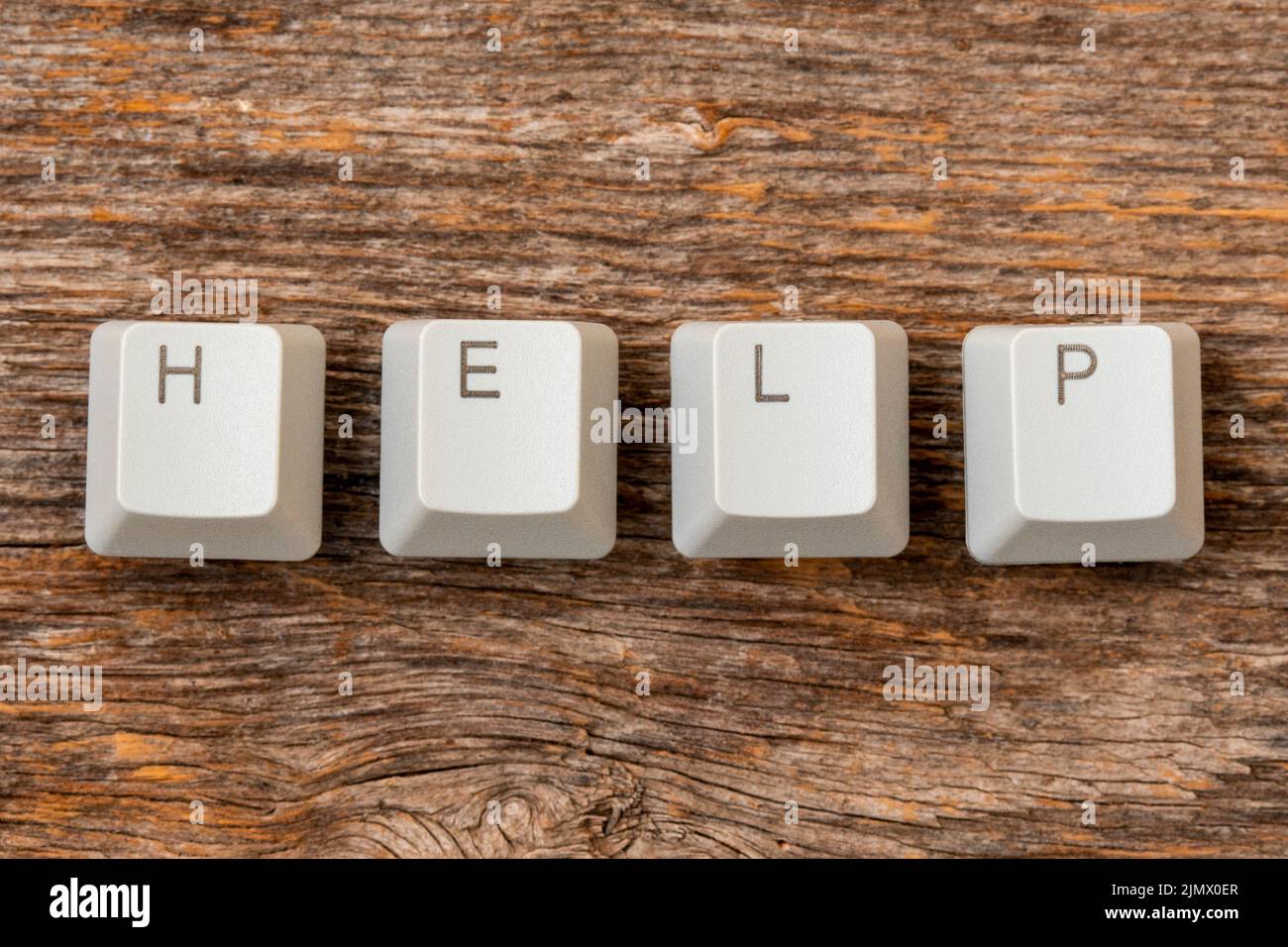 Four computer keyboard keys arranged to spell HELP word Stock Photo - Alamy