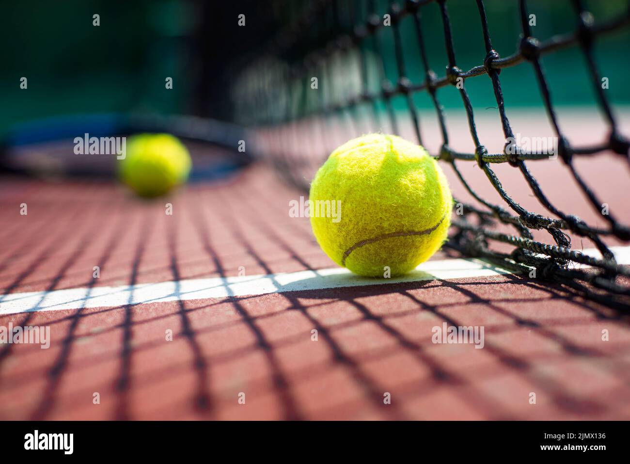 Tennis ball lying on the court. Healthy lifestyle concept Stock Photo
