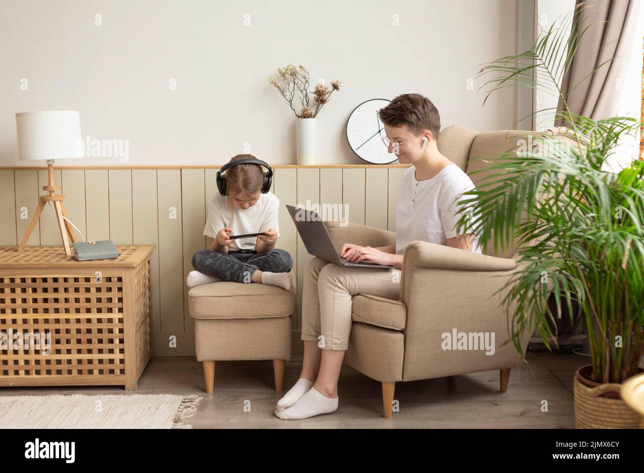 Full shot parent kid with devices Stock Photo