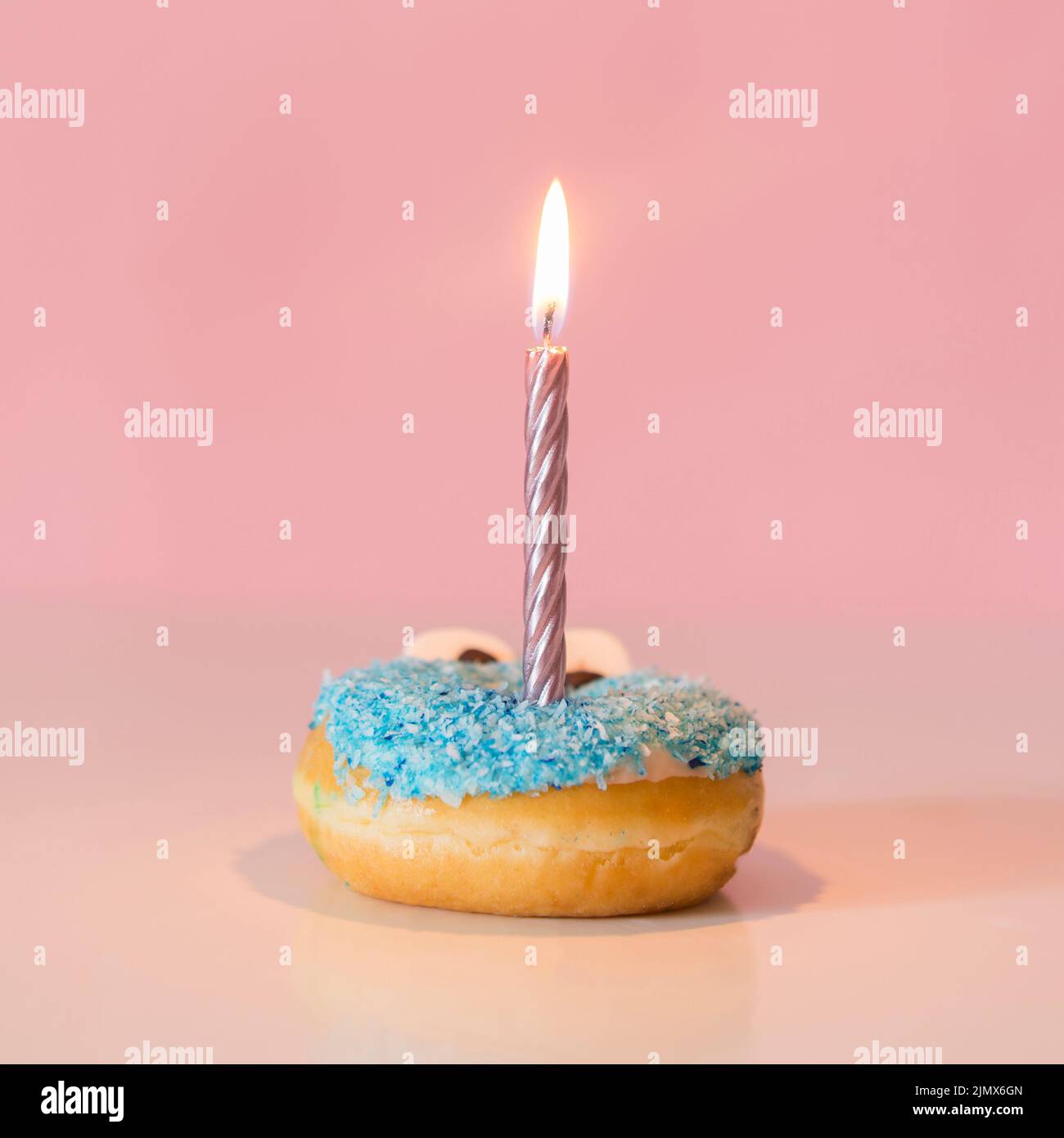 Front view donut with lit candle Stock Photo
