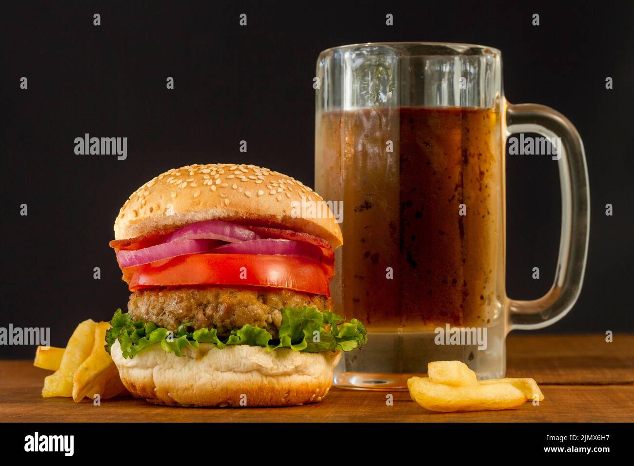 Fresh hamburger with fries beer mug Stock Photo