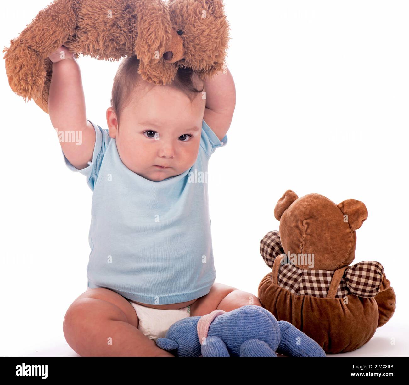Baby with teddy bears. Sweet child with teddy bears isolated on white