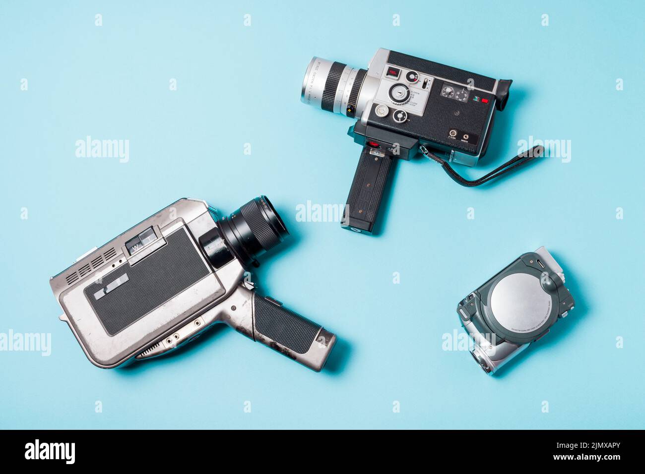 Different type camcorder blue background Stock Photo Alamy