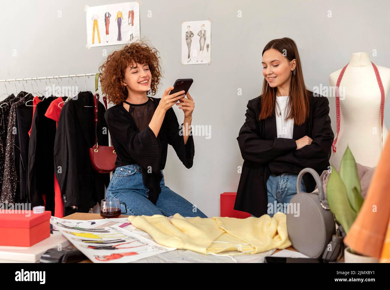 Clothes designers working store Stock Photo - Alamy