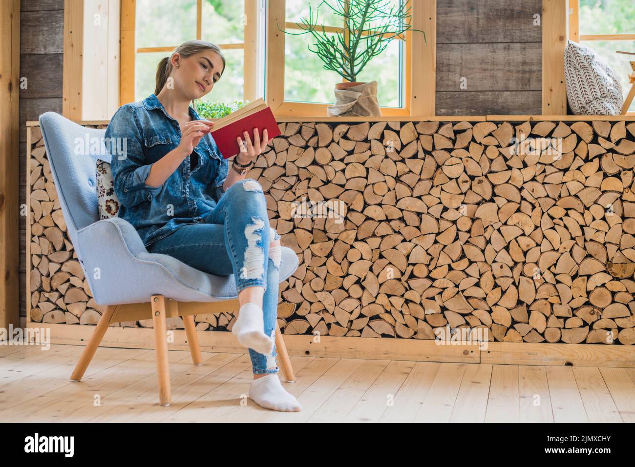 Classy young woman looking book Stock Photo