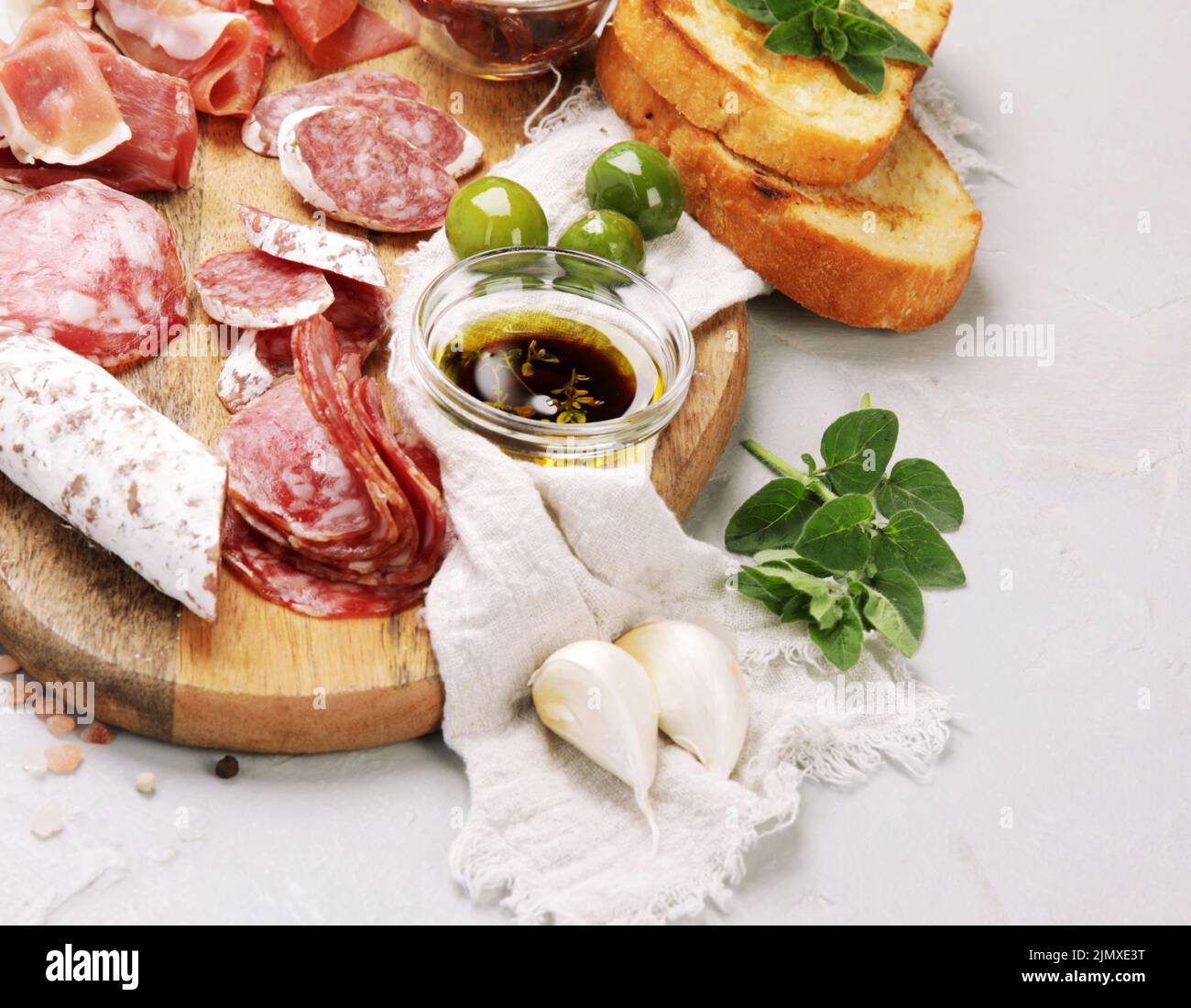 Sausages assortment on light background. Meat product made of finely chopped and seasoned meat. copy space Stock Photo