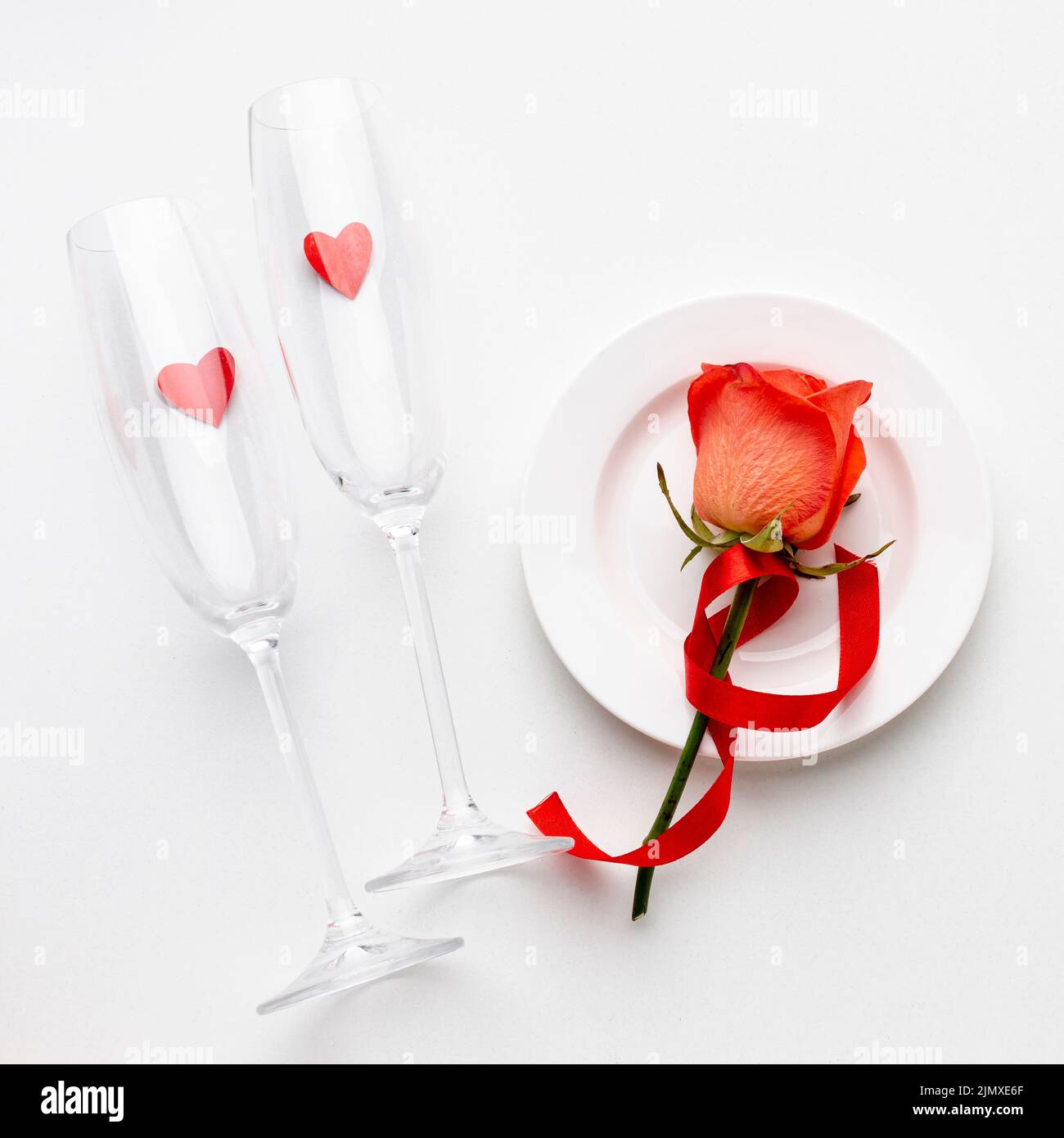 Arrangement with champagne glasses white background Stock Photo