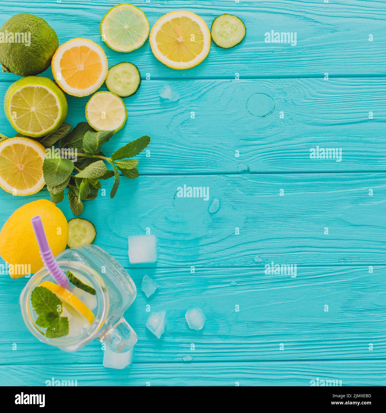 Blue wooden surface with lemons limes Stock Photo