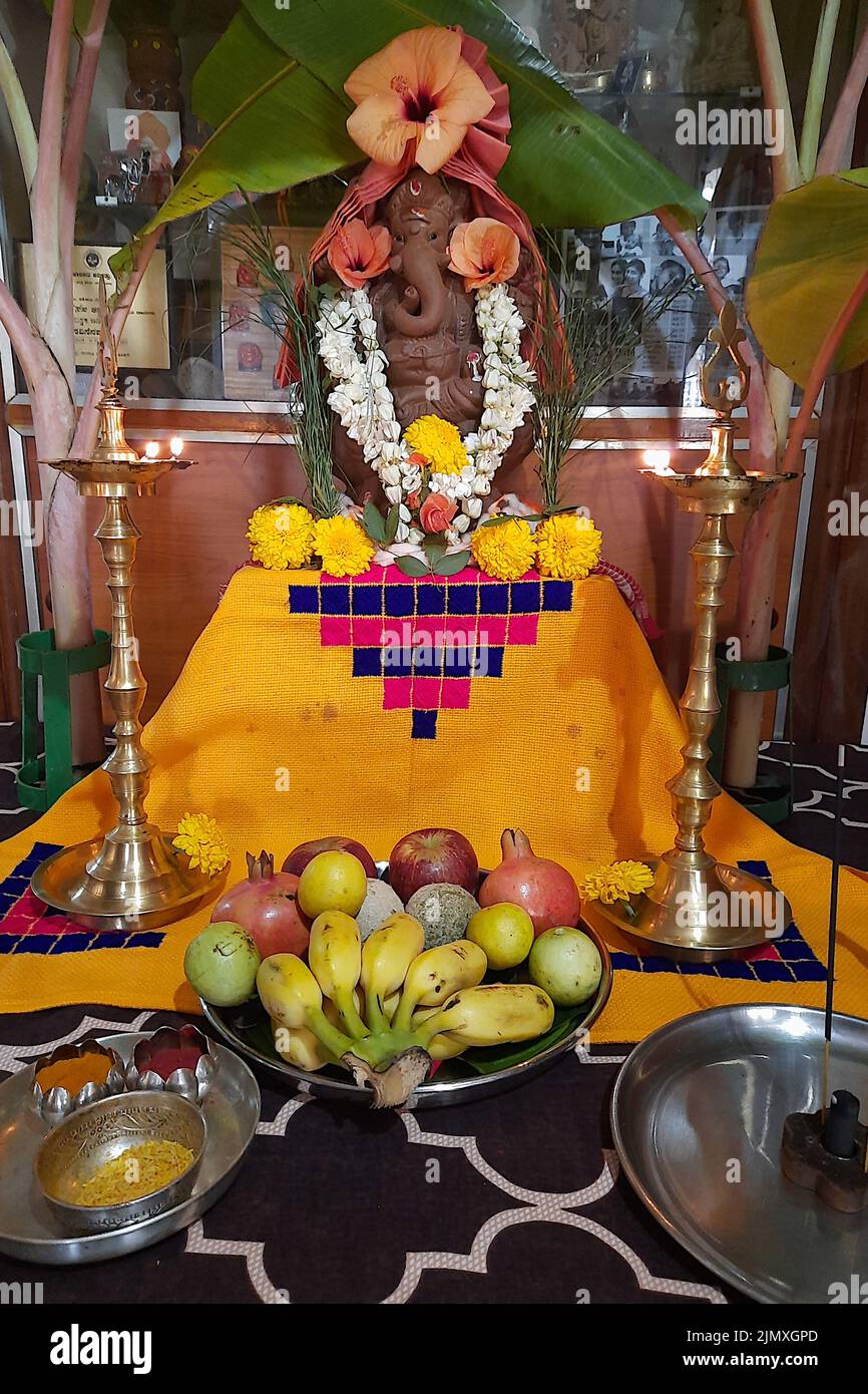 Puja celebration of unpainted earthen Ganesha idol on Ganesha Chaturthi