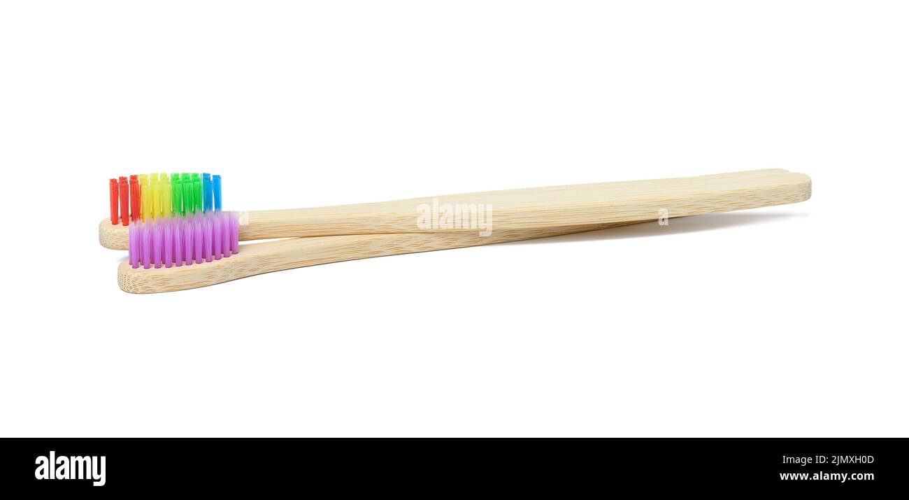 Bamboo toothbrushes on a white isolated background Stock Photo