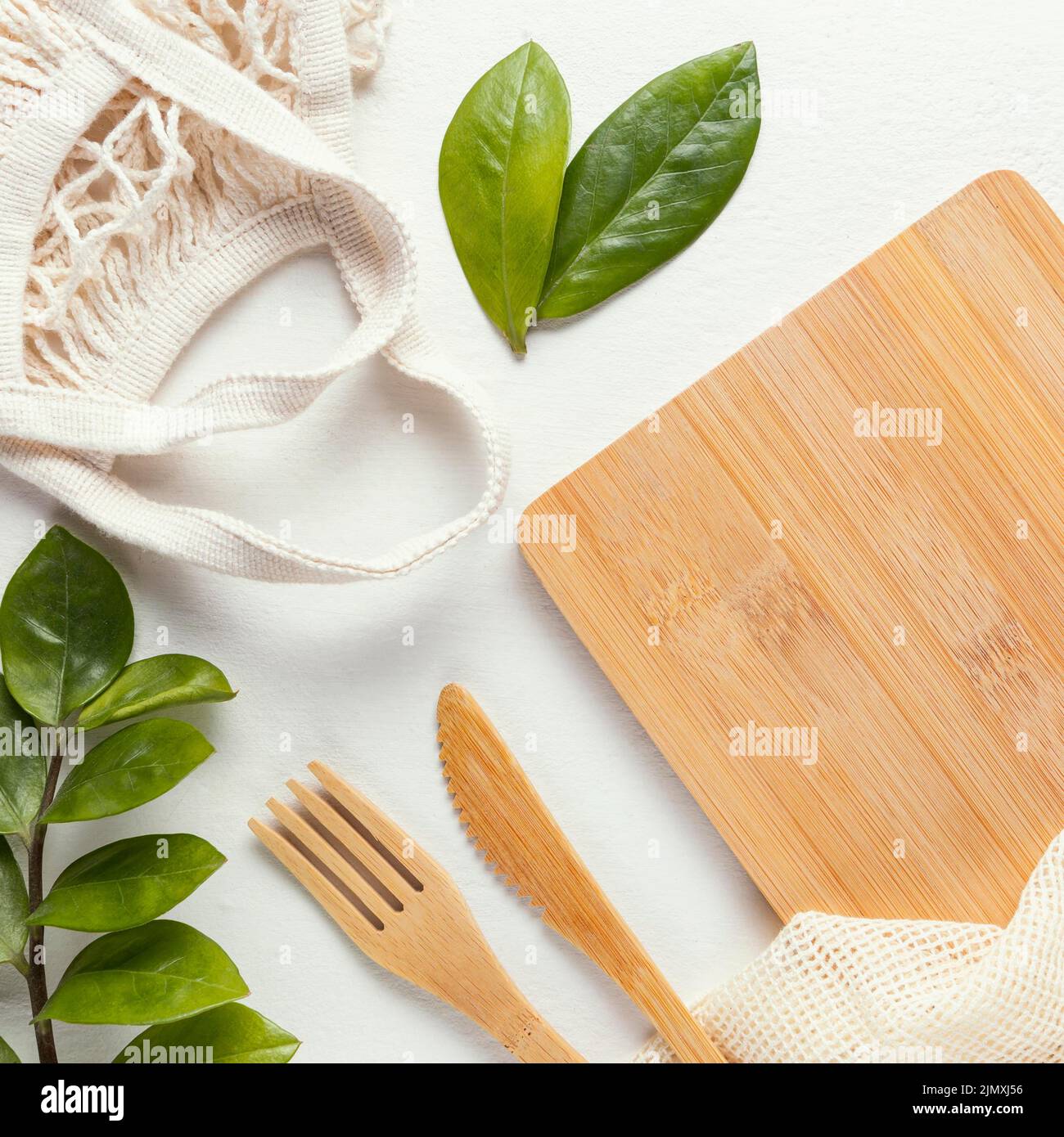 Wooden board with cutlery Stock Photo