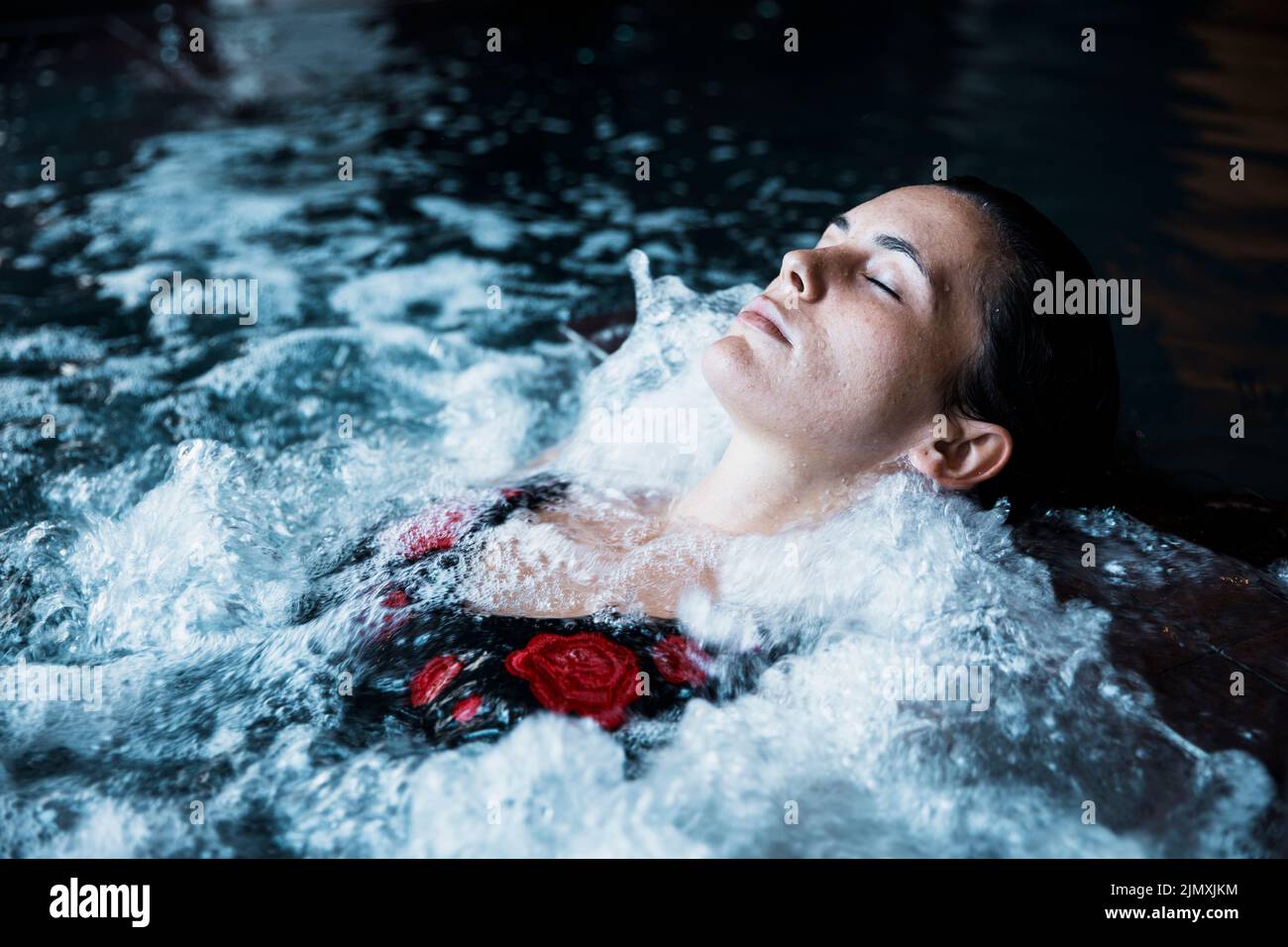 Woman relaxing whirlpool Stock Photo