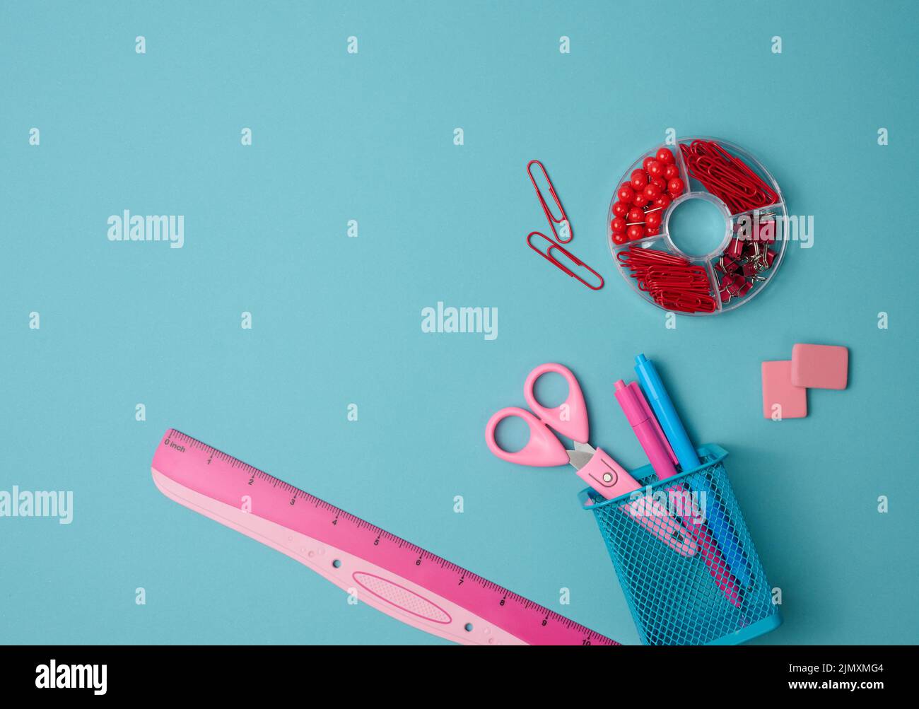 Paper clips, buttons, scissors on blue background, top view Stock Photo