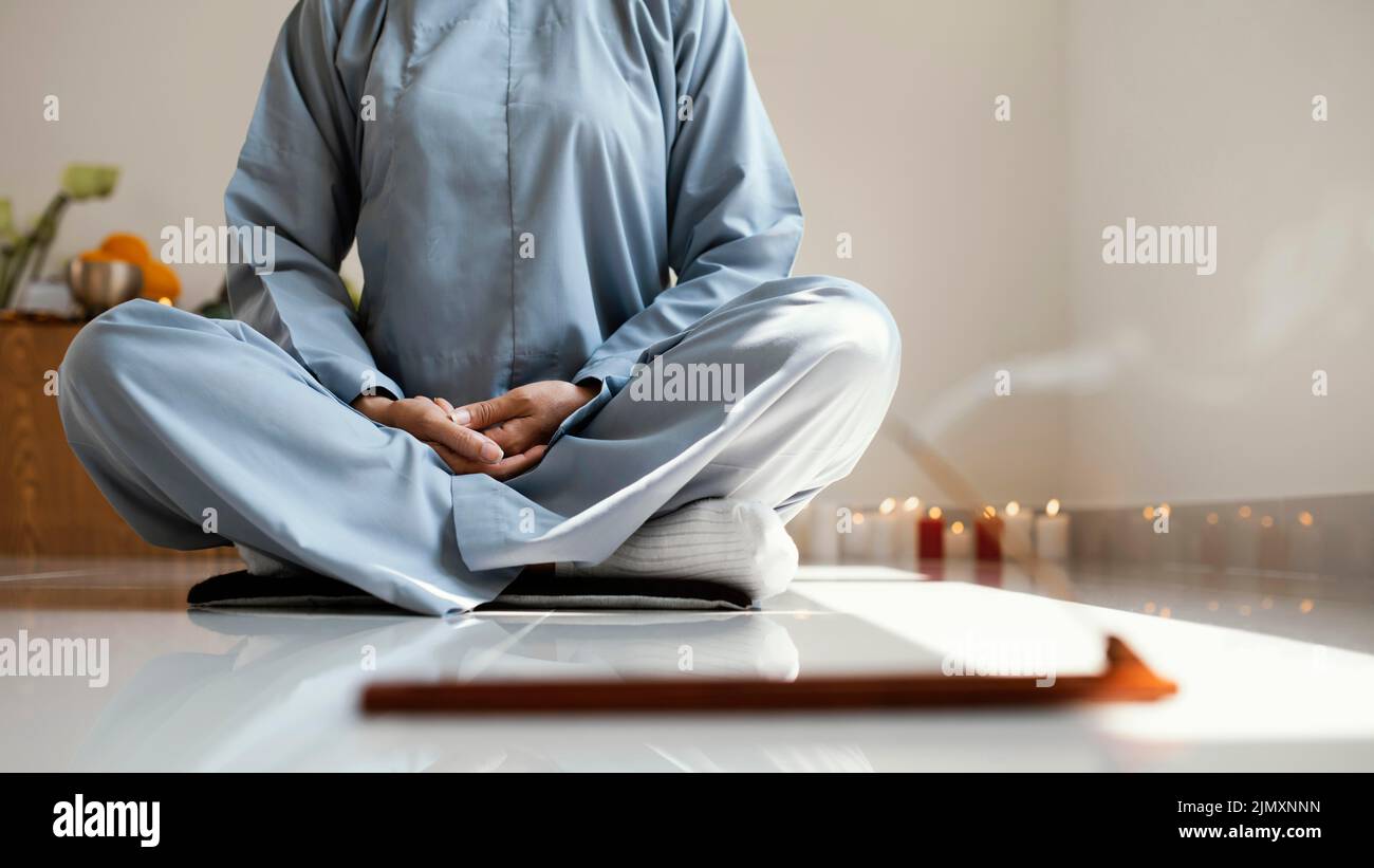 Front view woman meditating Stock Photo