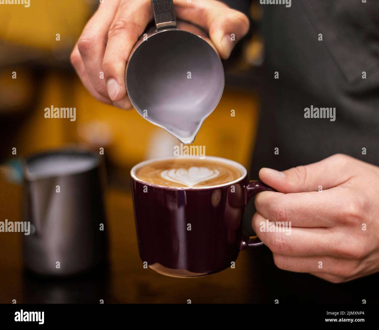 Front view male barista pouring coffee cup Stock Photo