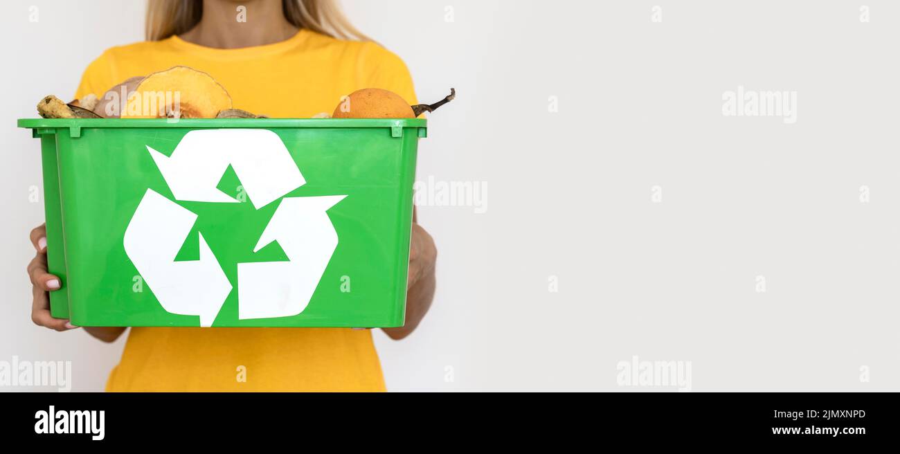 Front view woman holding recycle bin with copy space Stock Photo