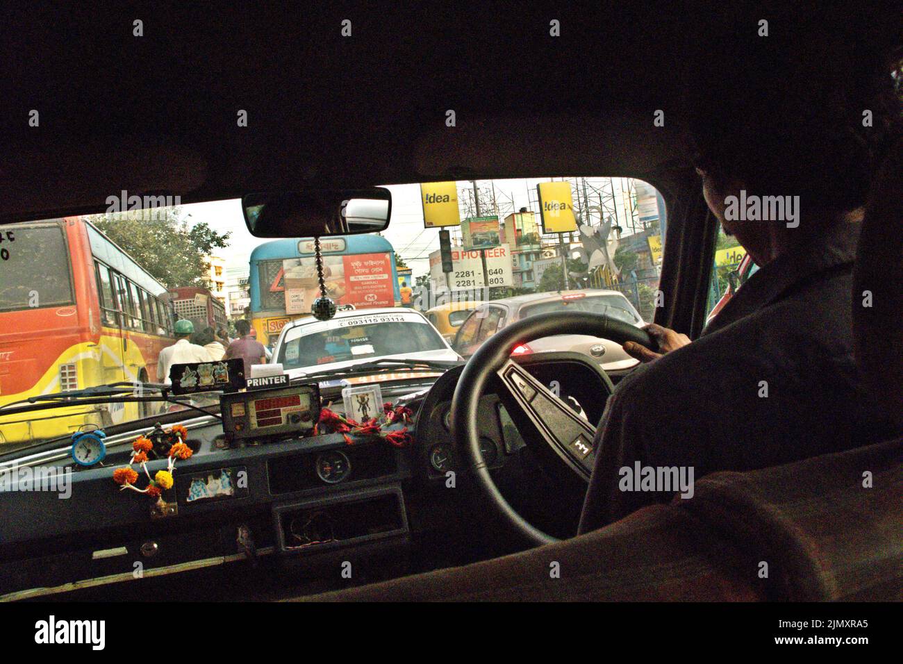 Road traffic is seen from inside a taxi in Kolkata, West Bengal, India. Stock Photo