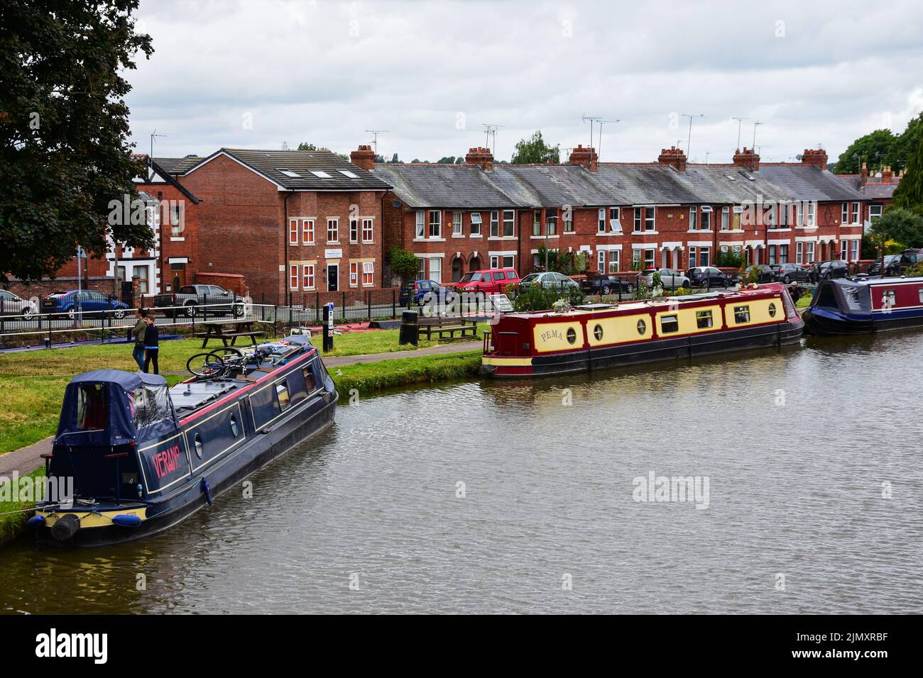 Chester, UK: Jul 3, 2022: A general scene of the Shropshire Union Canal in Chester, with narrow boats moored in the canal basin Stock Photo